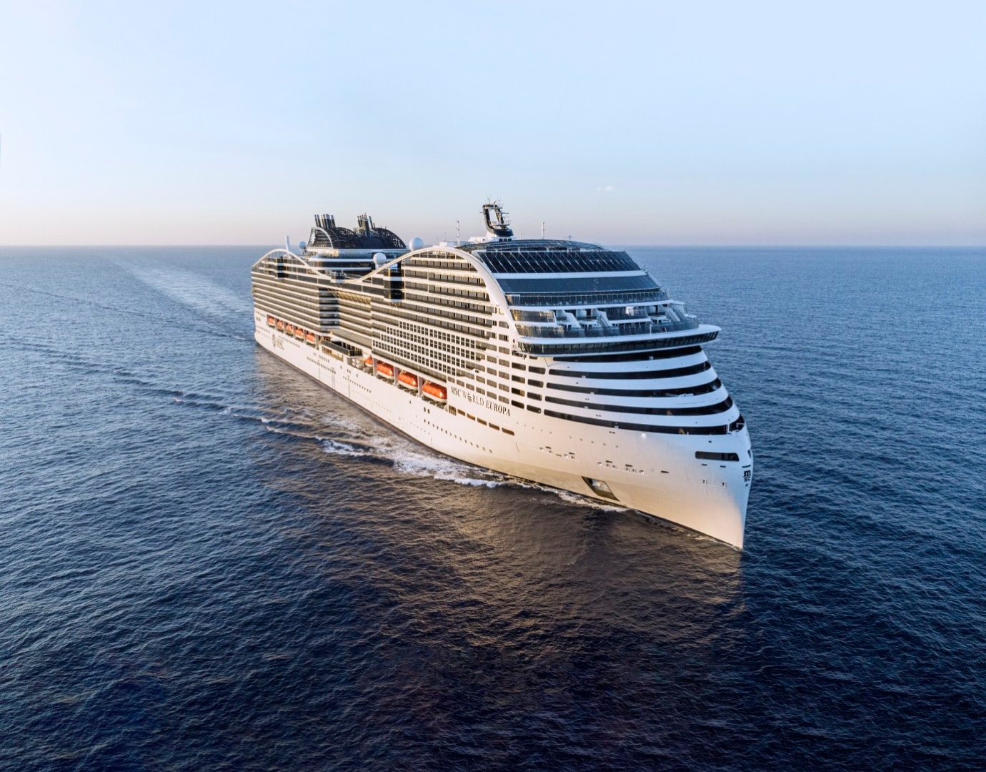 The MSC World Europa cruise ship gliding through calm waters | MSC Cruises The MSC World Europa cruise ship gliding through calm waters | MSC Cruises