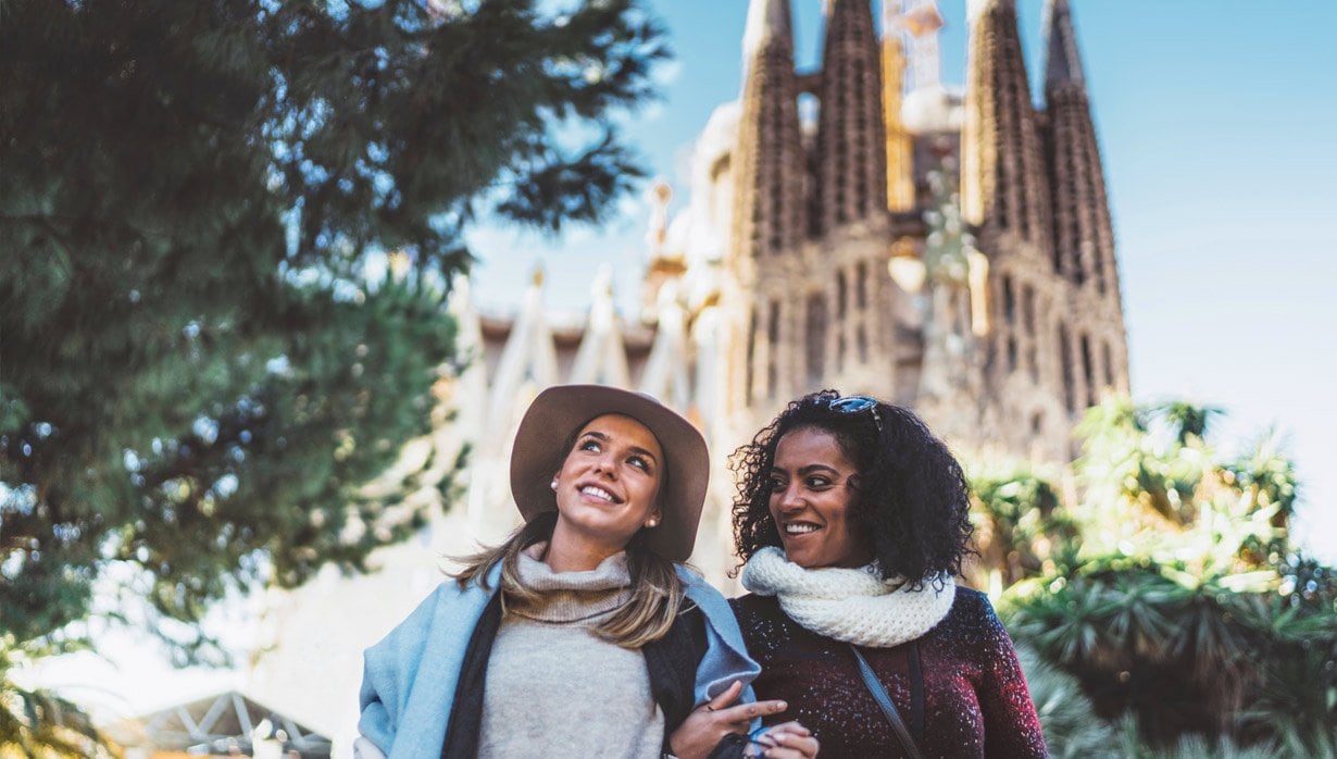Two friends enjoying a sunny day in front of the Sagrada Familia in Barcelona | MSC Cruises Two friends enjoying a sunny day in front of the Sagrada Familia in Barcelona | MSC Cruises