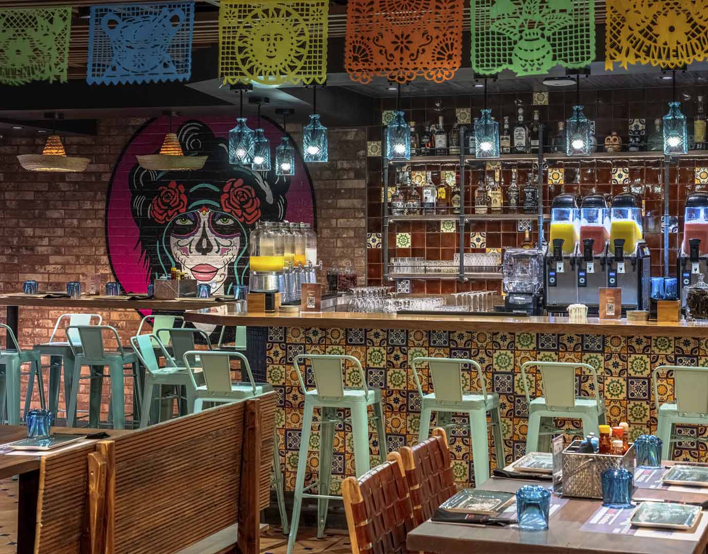 A vibrant bar with colorful decor and drinks onboard the cruise ship | MSC Cruises