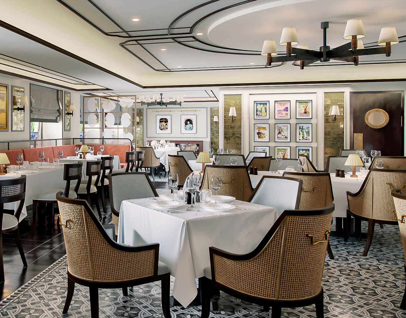 Elegant onboard restaurant with white tablecloths, stylish chairs, and decorative wall art | MSC Cruises