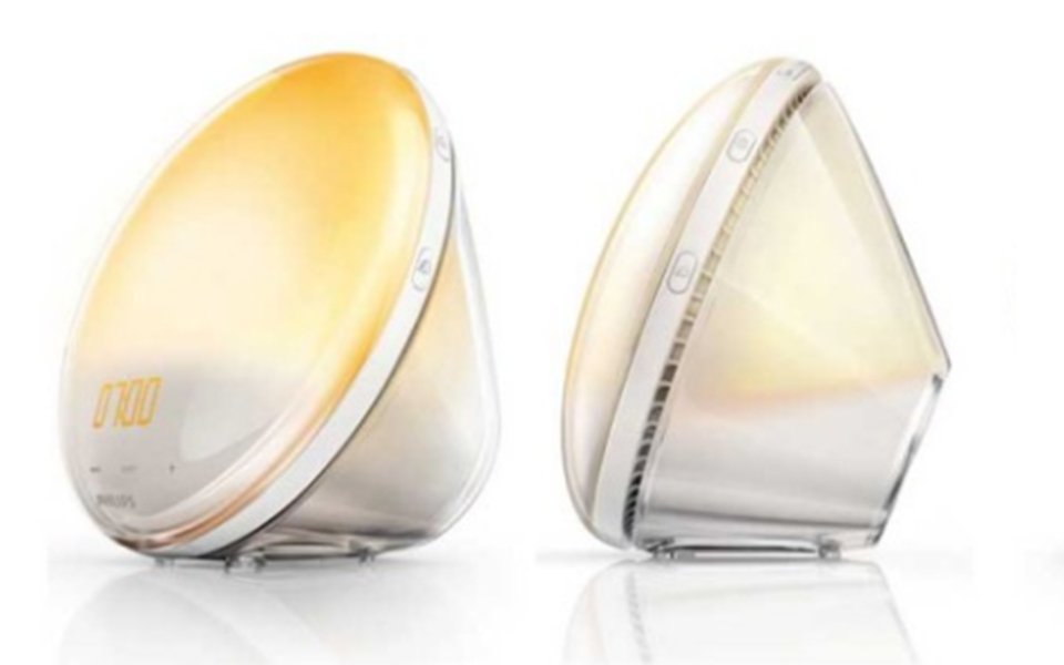 Two modern sunrise simulation alarm clocks with warm yellow light | MSC Cruises