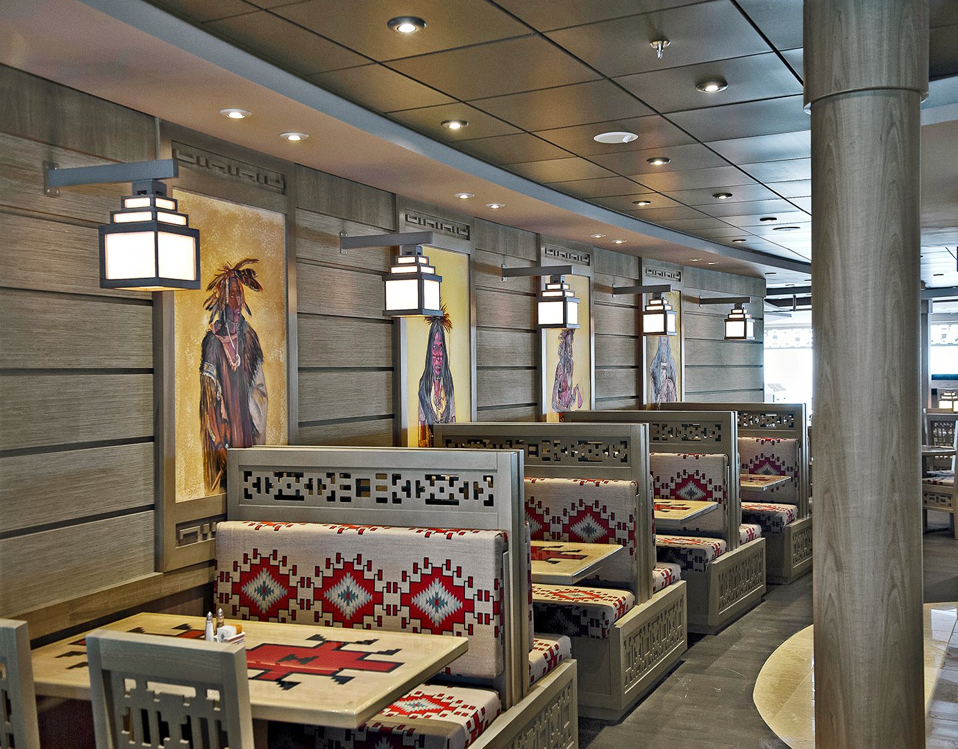 Cozy restaurant with Native American-inspired decor and patterned booth seating onboard | MSC Cruises Cozy restaurant with Native American-inspired decor and patterned booth seating onboard | MSC Cruises